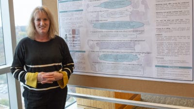 Carol Thrush, Ed.D. with research poster