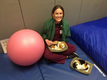 Therapist poses with items in sensory deprivation room