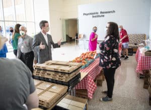 Chancellor Cam Patterson, M.D., MBA, tours the Farmers Market on May 19.