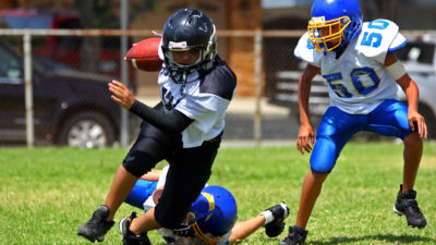 Young kids playing football