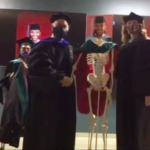 The College of Health Professions Physical Therapy program used skeletons as stand ins for the students in their hooding ceremony.