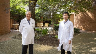 Portrait of Metha and Ding outside