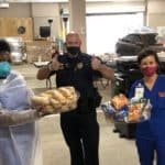 Deb Hutts, Sgt. Greg McKinney and Yukari Juniel offer thanks for lunches donated by members of the Arkansas Legislature to those working COVID-19 screening sites at UAMS.