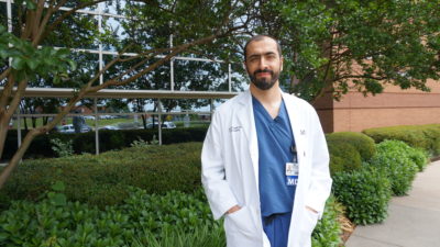 Dr. Giorgakis posing for photo outside
