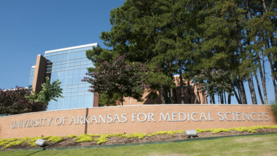 A variety of trees stand near one of the gateway entrances to the UAMS campus, recently recognized for the seventh consecutive year as a Tree Campus USA.