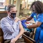 Chancellor Cam Patterson, M.D., MBA, gets his annual flu shot. The popup clinics for employees, students and volunteers start Sept. 21.