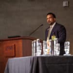 Brian Gittens, Ed.D., vice chancellor for diversity, equity and inclusion, delivers his State of Diversity and Inclusion address, with the Dr. Edith Irby Jones Excellence in Diversity and Inclusion Awards in the foreground.