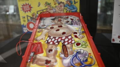 Different versions of the classic board game Operation are included in the exhibit.