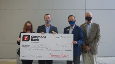 UAMS Chancellor Cam Patterson, M.D., MBA, holds the $25,000 check with Amy Wenger, M.H.S.A., vice chancellor for Regional Campuses and Robert "Rob" Robinson, community president for Simmons Bank El Dorado. To their right is Freddie Black, chief business development officer for Simmons Bank.