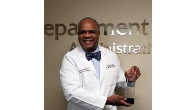 Dr. Davis with award