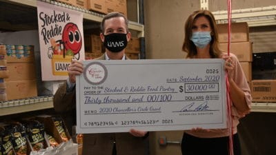 Chancellor Patterson presents Tonya Johnson with the $30,000 grant for Stocked & Reddie. Since opening on July 15, 2019, Stocked & Reddie has provided more than 68,000 meals to more than 1,100 active members.