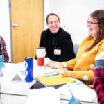 Mark Koch, OTD, (center) speaks with students Awbrey Gibby and Sarah Arenas during a class in January.