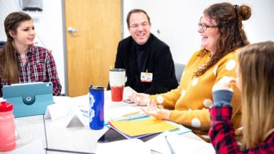 Mark Koch, OTD, (center) speaks with students Awbrey Gibby and Sarah Arenas during a class in January.