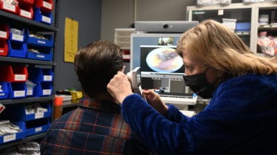 Pam de Gravelles, Ph.D., RN, with the UAMS College of Nursing, demonstrates digital health peripherals used in training purchased with funds from the Gertrude E. Skelly Charitable Foundation while connected with a remote training hub.