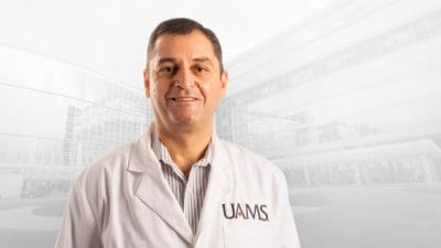 photo of Gaurav Dhar, M.D., in white coat