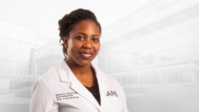 Jaleesa Jackson in white coat