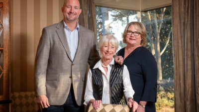 Marge Schueck (center) and her children, Patrick Schueck and Jennifer Schueck McCarty. The family is passionate about UAMS achieving NCI Designation and sees their gift as having an immediate impact toward reaching that goal.