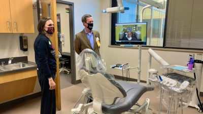 Chancellor Cam Patterson, right, tours the new UAMS Dental Hygiene Clinic in the Freeway Medical Tower.