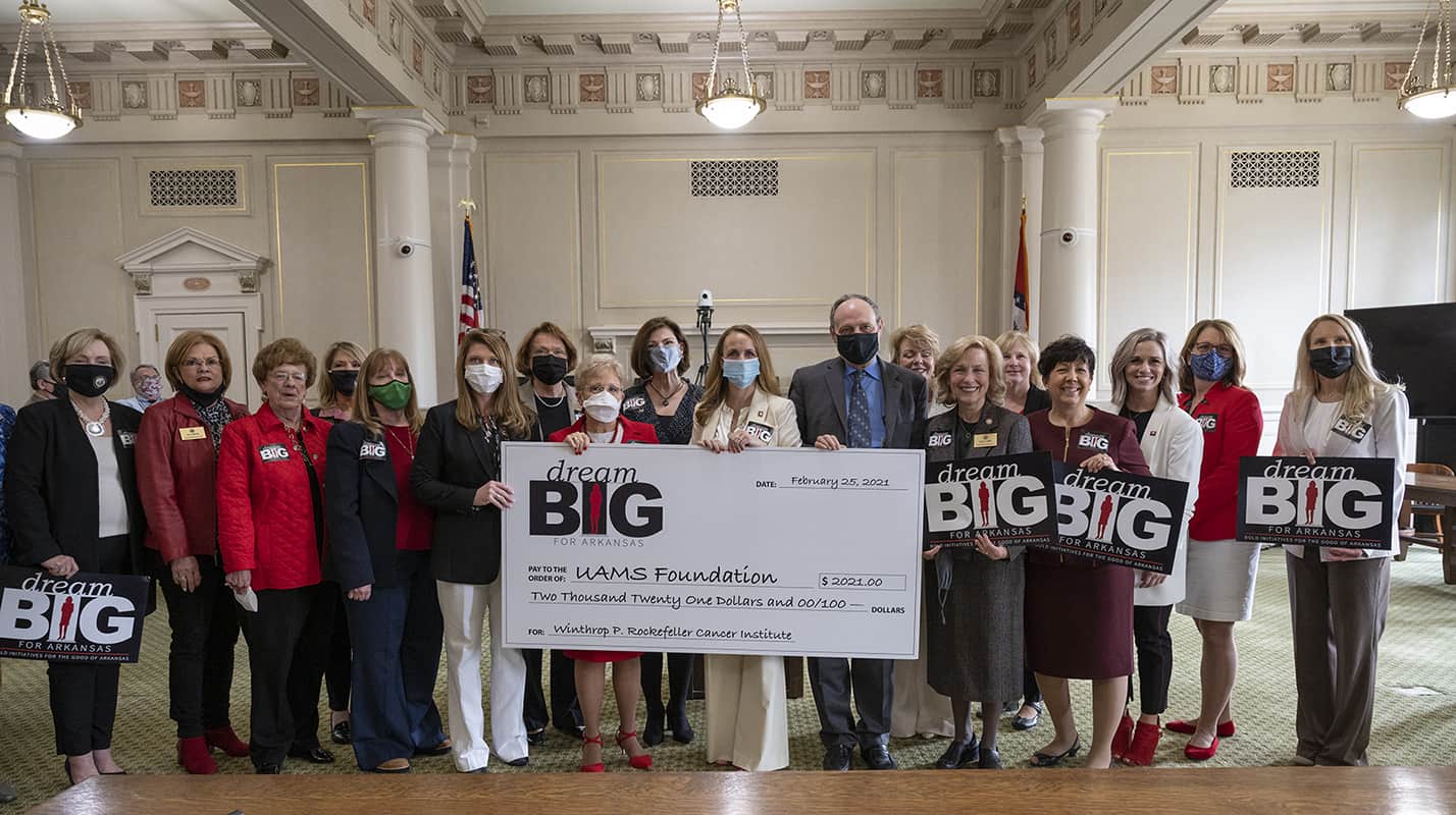 Sen. Missy Irvin of Mountain View and Rep. Michelle Gray of Melbourne, backed by more than a dozen other members of the Republican Women’s Legislative Caucus, presented an oversized check for $2,021 to Michael J. Birrer, M.D., Ph.D., vice chancellor and director of the Winthrop P. Rockefeller Cancer Institute at UAMS during a noon presentation Feb. 25 at the Arkansas State Capitol.