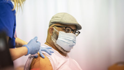 A nurse vaccinates a patient March 12 at Shorter College.
