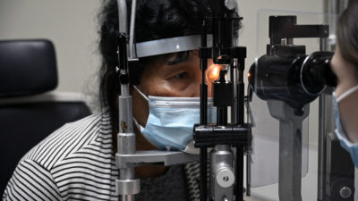 Libos Gold, 60, has her left eye examined by Carina Sanvicente, M.D., the day after her cataract surgery.