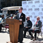 UAMS Chancellor Cam Patterson speaks April 1 at a news conference at Simmons Bank Arena.