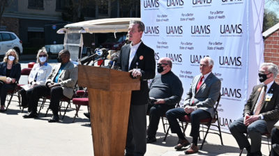 UAMS Chancellor Cam Patterson speaks April 1 at a news conference at Simmons Bank Arena.