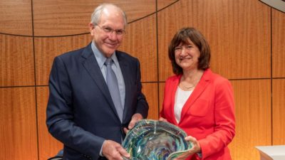 College of Medicine Dean Christopher T. Westfall, M.D., is presented the Distinguished Faculty Service Award by UAMS Provost and Chief Academic Officer Stephanie Gardner, Pharm.D., Ed.D., at the college’s Dean’s Honor Day ceremony. The signature honor of the college is commemorated with an art glass bowl created by Arkansas artist James Hayes.