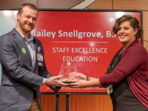 Leslie Stone, M.D., (left) presents the Staff Excellence – Education Award to Bailey Snellgrove, B.A., in recognition of her dedication to medical students during their Family Medicine Clerkship.