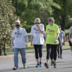 Chancellor Cam Patterson, M.D., MBA, walking with participants during the Be a Part of the Cure Walk on Saturday, May 1.