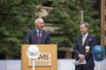 Gov. Asa Hutchinson speaks Tuesday at the groundbreaking ceremony for the UAMS Radiation Oncology Center as UAMS Chancellor Cam Patterson, M.D., MBA, looks on. The expanded Radiation Oncology Center will house Arkansas’ first Proton Center, a partnership between UAMS, Baptist Health, Arkansas Children's and Proton International.
