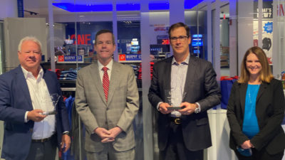 From left, Madison Murphy; UAMS Chancellor Cam Patterson; Andrew Clyde, president and CEO of Murphy USA; and Amy Wenger at the Murphy USA corporate headquarters in El Dorado. Murphy and Clyde were presented with commemorative plaques in recognition of their generous commitment.