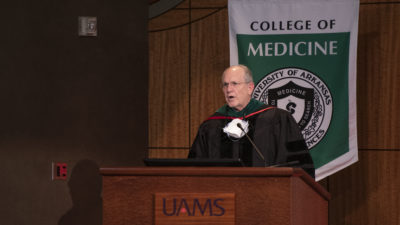 Christopher Westfall, M.D., outgoing dean of the College of Medicine, addresses his last class of graduates.