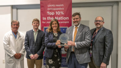 From left, C. Lowry Barnes, M.D., Jeffrey Stambough, M.D., Alicia Dreyer of Healthgrades, Ben Stronach, M.D., and Simon Mears, M.D., Ph.D., at the award presentation ranking UAMS among the top 10% of providers for joint replacement.