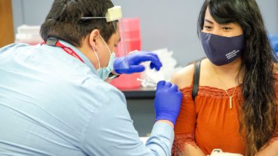 A Marshallese resident in Northwest Arkansas receives a COVID-19 vaccine.