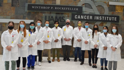 The NIH-funded Partners in Cancer Research Program is underway at the Winthrop P. Rockefeller Cancer Institute. Second-year medical students learning clinical and in-depth cancer research this summer include (l to r) Nadia Safar, Anna Bragg, Pamela Rosales, Payton Smith, Carl Ramponi, Faizan Cheema, Tom Kelly, M.D. (associate director of Cancer Research and Training), Angel Castro, Robert Kiss, Delanie Mack, Sangeetha Sonney and Claire Keisling. Matthew Newman is not pictured.