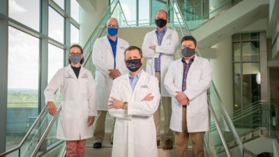 Members of the UAMS proteomics team are Alan Tackett, Ph.D. (center front), and (l-r) Stephanie Byrum, Ph.D., Rick Edmondson, Ph.D., Aaron Storey, Ph.D., and Samuel Mackintosh, Ph.D.