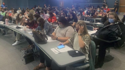 First-year students in the College of Pharmacy wait to begin their first day of orientation on Aug. 2, 2021.