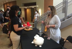 Deidra Harber of Yazoo City, Mississippi, a graduate assistant in the College of Pharmacy, visited with Janice Nottenkamper, student financial manager with the UAMS Student Financial Services Debt Management department. 