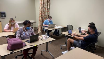 Pharmacy students work on their group business plan during the NCPA Foundation-UAMS Pharmacy Ownership & Leadership Academy.
