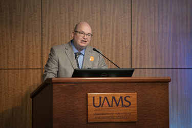 John Arthur, M.D., Ph.D., presents the findings of his research team.