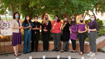 Doctors, nurses, social workers, pastoral care and genetic counselors gathered at sunset on Oct. 7 to remember more than 250 perinatal losses at UAMS during the past year.