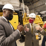 Chancellor Cam Patterson, right, shares a thumbs-up moment with Little Rock Mayor Frank Scott Jr. after the mayor turned on one of the generators in the new power plant at the conclusion of the formal opening of the facility.