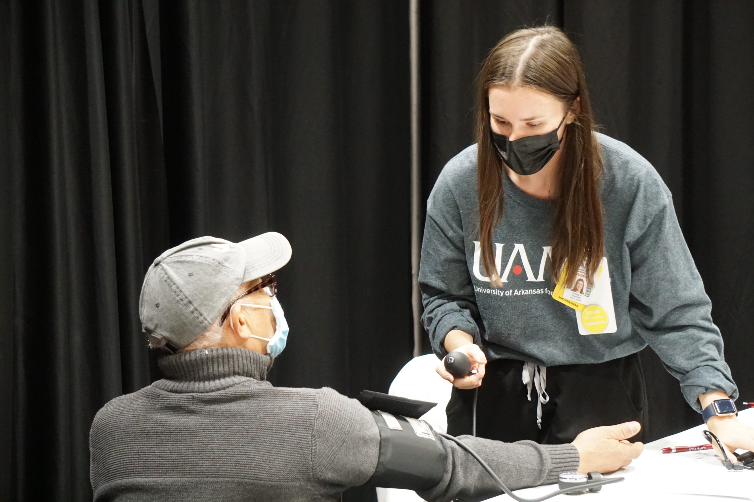 UAMS staff conducts a blood pressure test