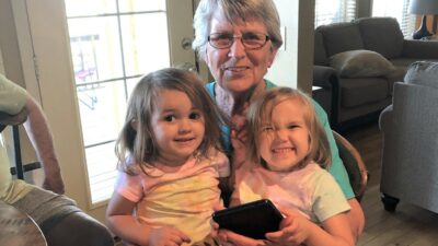 Cornelia Ann Smith of Calico Rock, Ark., here with two of her grandchildren, is pain free thanks to her participation in a UAMS study of an advance in spinal cord stimulation devices.
