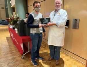 Michael Eledge was one of a dozen students presented COVID-19 Appreciation Awards for their help in assisting the state of Arkansas during the pandemic.