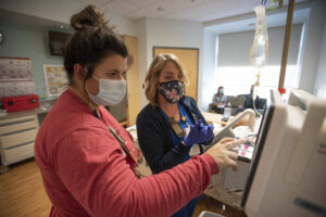 Nurses in the unit of the University of Arkansas for Medical Sciences where myeloma patients are treated prepare Dave Puente's genetically modified cells to be infused back into him.