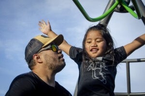Father and daughter on playground