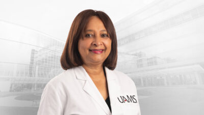 Barbara Porchia, DPM, in white coat
