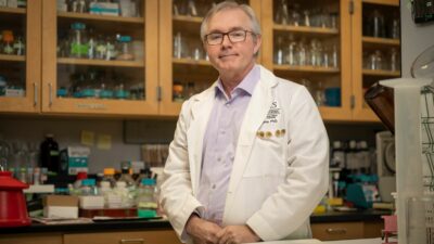 Kevin Raney, Ph.D., in his lab at UAMS.